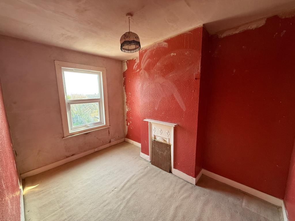 Lot: 90 - ESTABLISHED MID-TERRACE HOUSE FOR IMPROVEMENT - Bedroom 2 with double glazed window to rear and fireplace